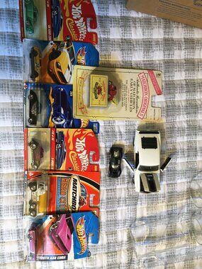 Diecast Cars Including a Mustang With Openable Doors and Hood